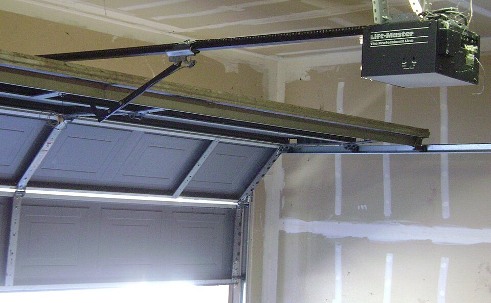 Garage door with an overhead garage door opener